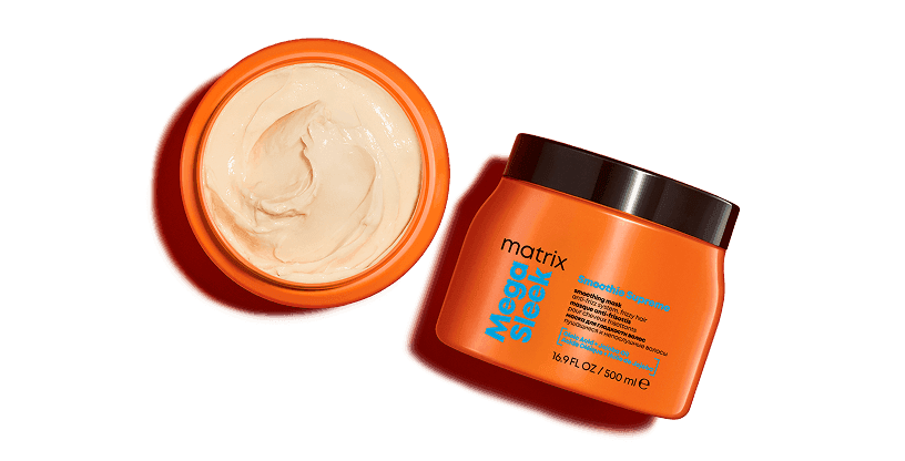 Treść wiadomości Gemini Maska Matrix Mega Sleek w dwóch słoiczkach na pomarańczowym tle. Jeden jest otwarty i widać w nim gęsty, jasny krem.