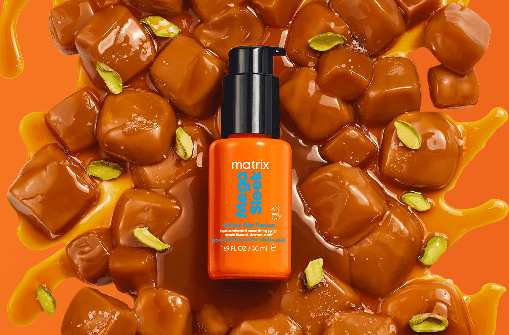 Treść wiadomości Gemini Serum Matrix Mega Sleek (50 ml) na apetycznym tle z kostek słonego karmelu i kawałków sycylijskiej pistacji.